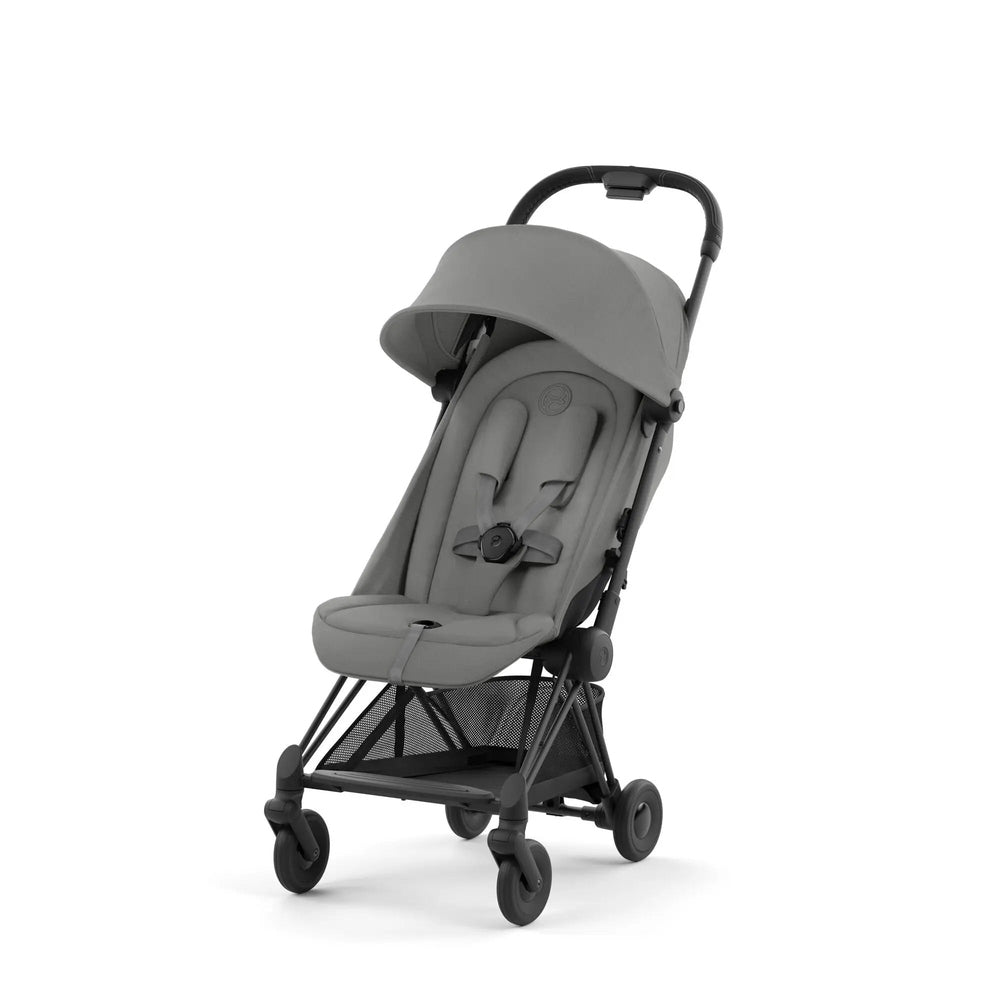Close-up of the Cybex Coya Matt Black Frame Stroller in gray fabric, shows canopy, overhead handle, and storage basket.