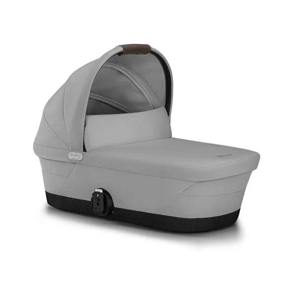 Close-up of the Cybex Gazelle S V2 Cot gray fabric bassinet for stroller with black base and brown leather-accent handle.