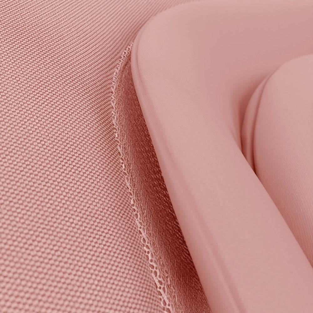 Close-up of the Cybex Lemo 2 Bouncer in pink fabric, where the curved seat edge gently hugs the sitter.