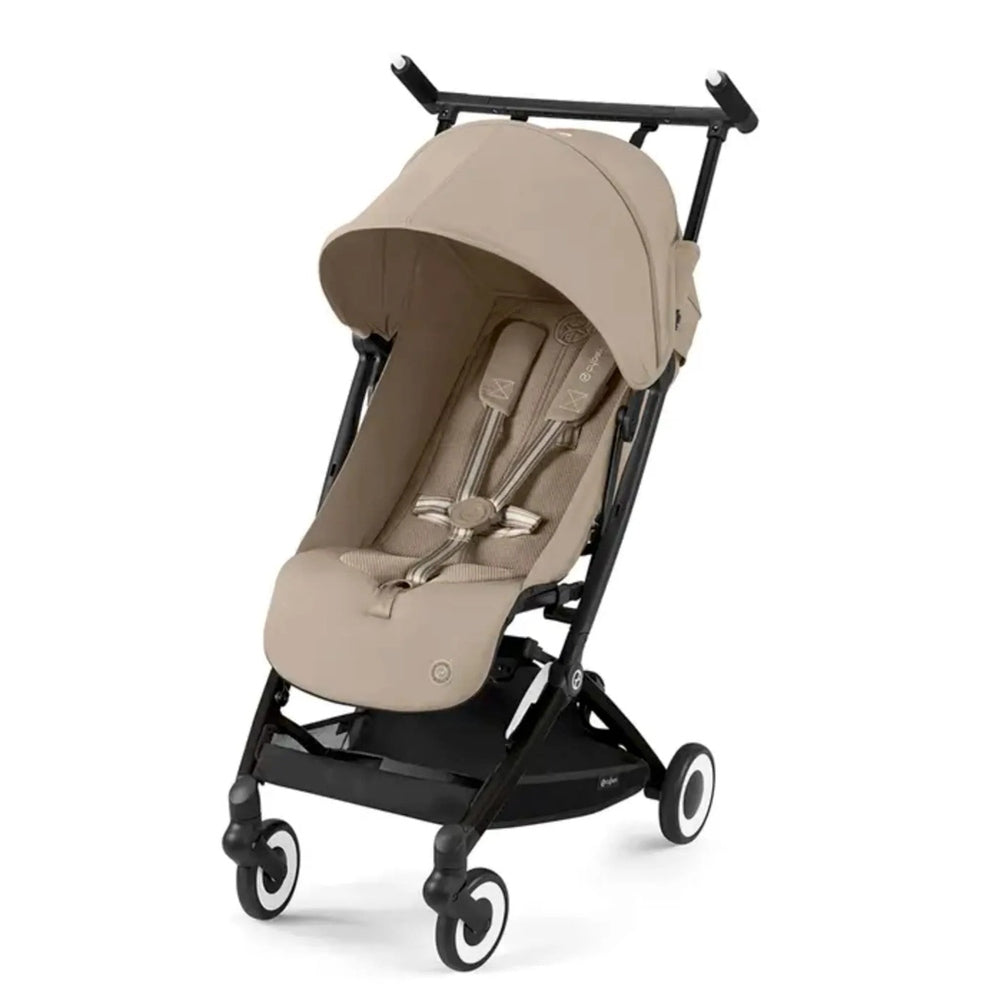 Close-up of the Cybex Libelle 2 Stroller in beige fabric with black frame; canopy extended for shade on the wheeled frame.