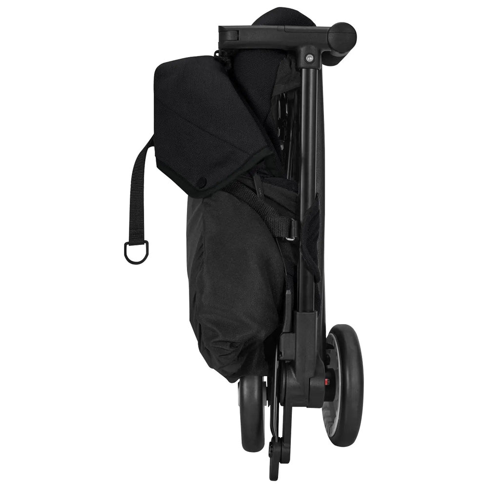 Close-up of the Cybex Libelle Stroller black compact-fold with wheels exposed as it's folded ready to carry.