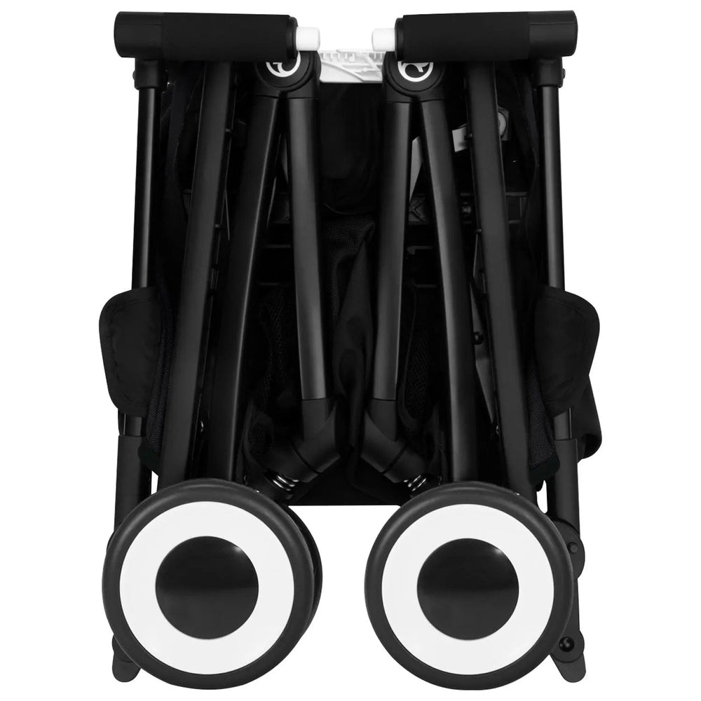 Close-up of the Cybex Libelle Stroller folded in black with white-ring wheels visible.