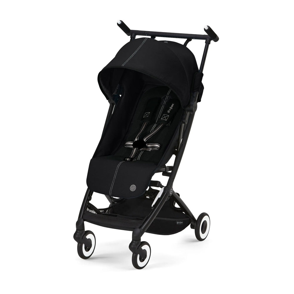 Close-up of the Cybex Libelle Stroller in black with canopy and compact foldable frame, four wheels ready for on-the-go use.