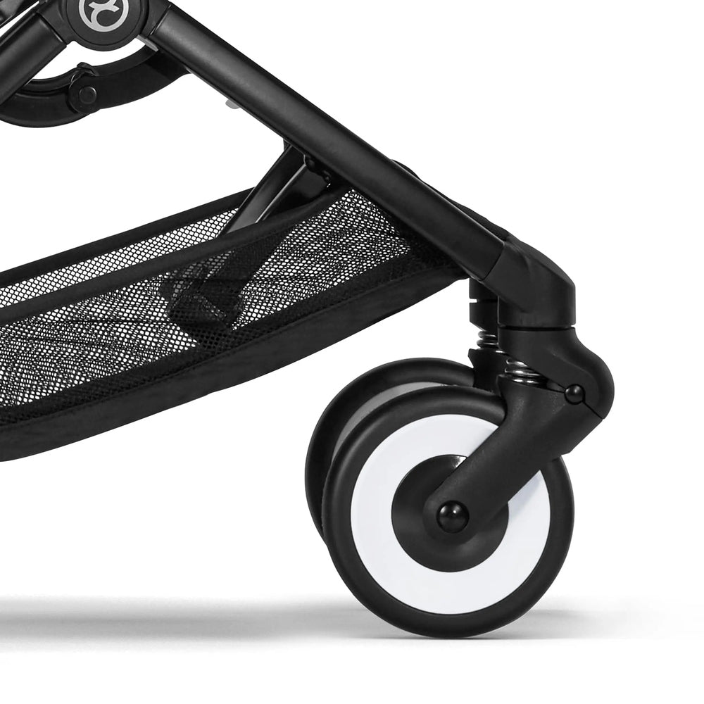 Close-up of the Cybex Libelle Stroller with black frame, swiveling front wheel and mesh storage basket.