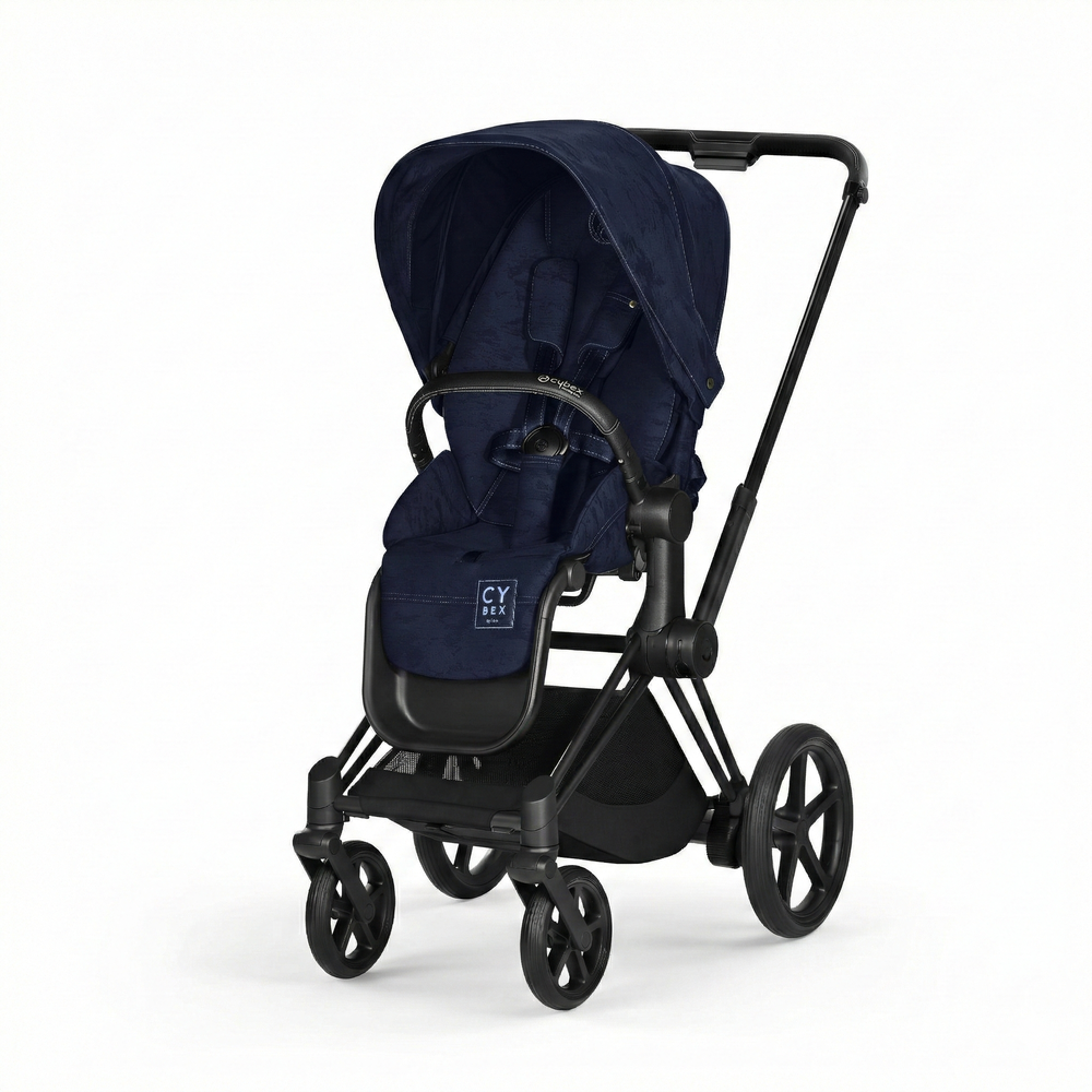 Close-up of the Cybex Platinum Priam 4 Stroller Limited Edition - Rebellious Luxury Denim Blue in denim blue fabric with black frame, navy canopy, and four wheels.