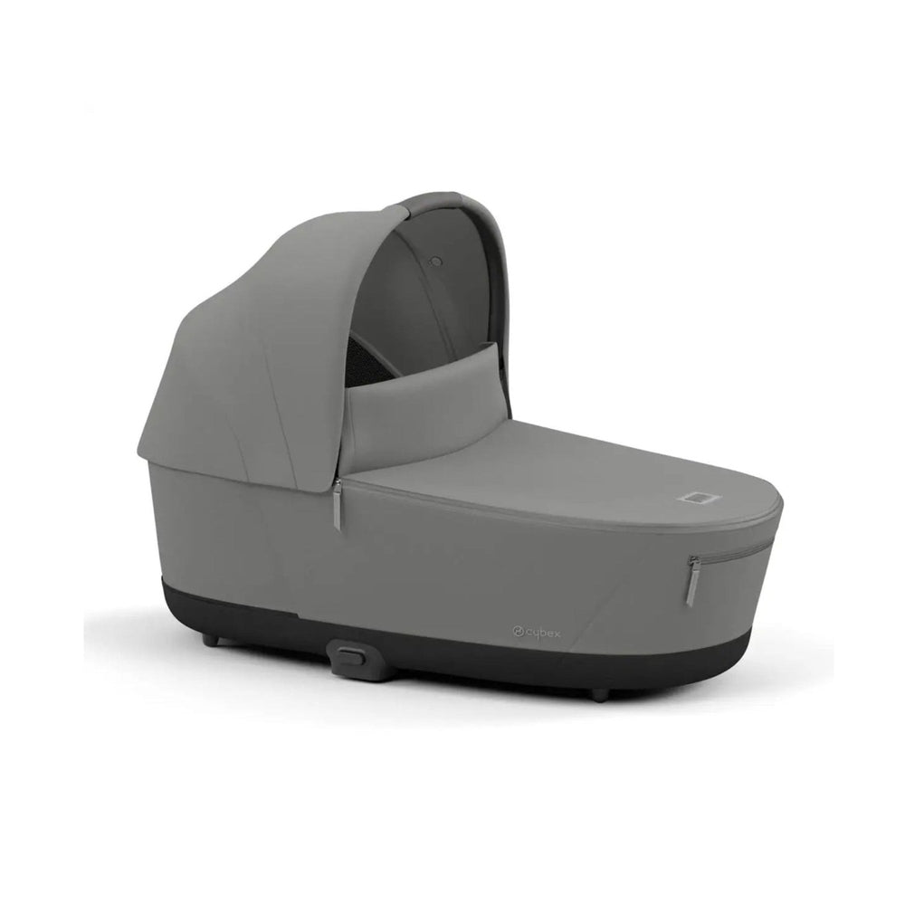 Close-up of the Cybex Platinum Priam Lux Carry Cot in gray fabric with extendable canopy and zip pocket.