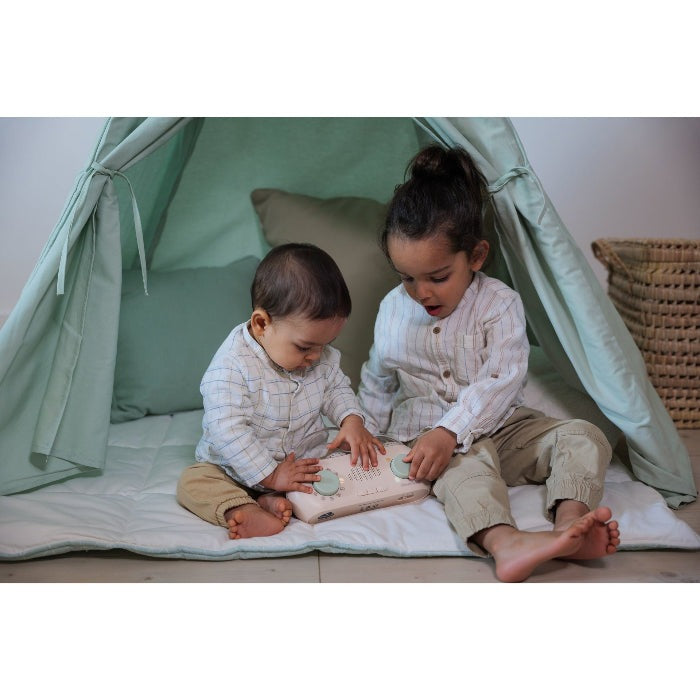 Cloud B Cloud Box Soothing Story Teller with Projections; two kids play with the device inside a mint tent.