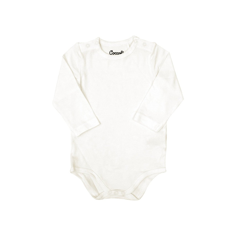 Coccoli Infant Cotton TENCELTM Modal Long Sleeve Bodysuit cream laid flat with shoulder and bottom snap buttons.