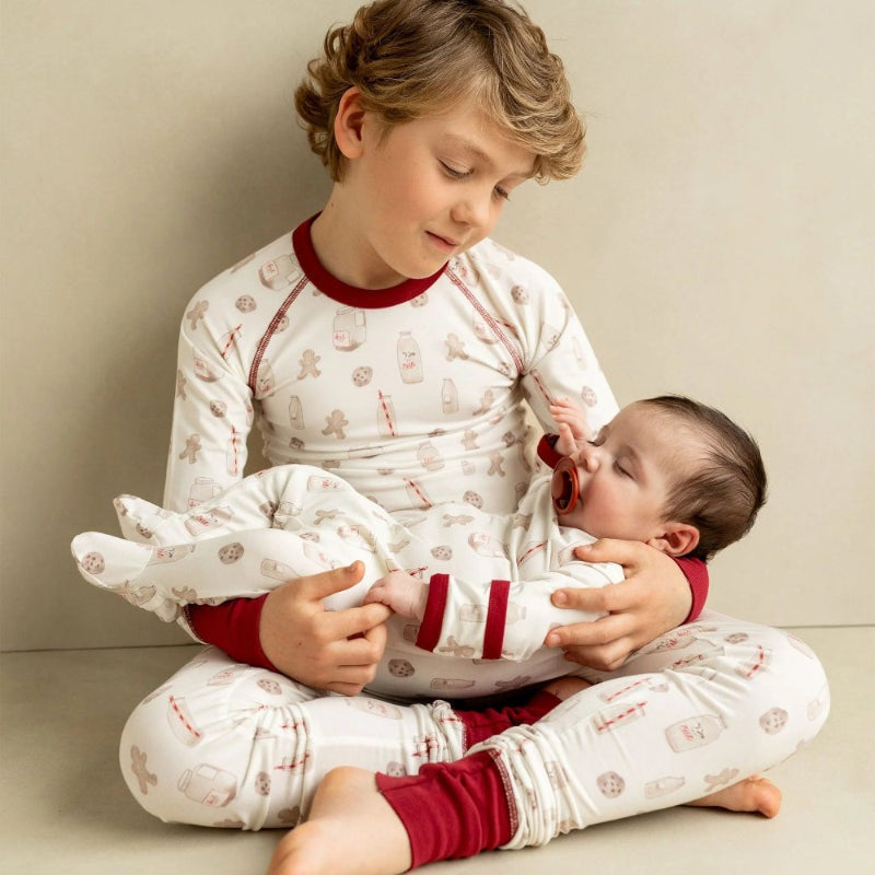 COCCOLI kid long-sleeve pajamas in white with red cuffs; cotton TENCEL Modal cookie print, includes 2 sleepers