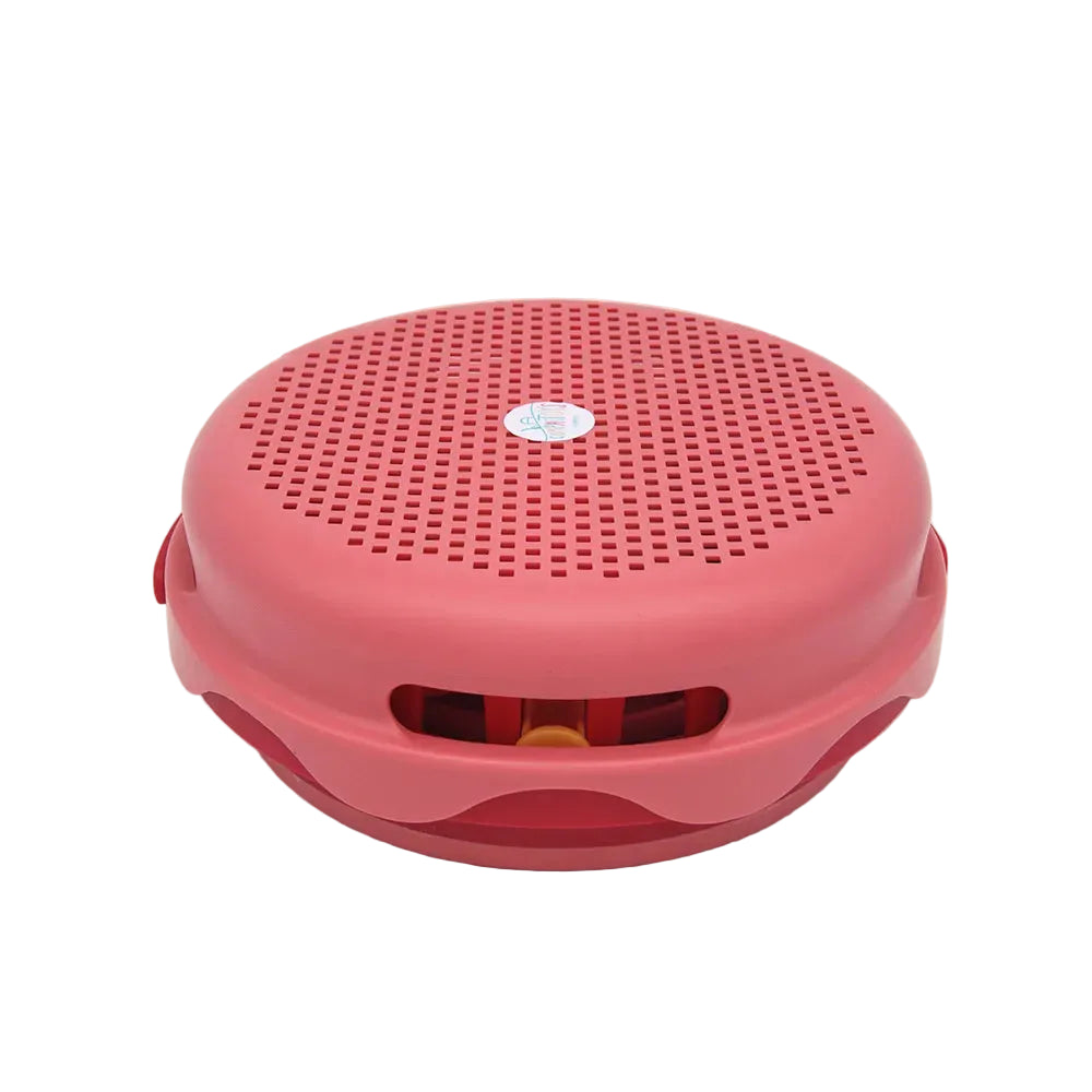 Pink round speaker on a white background