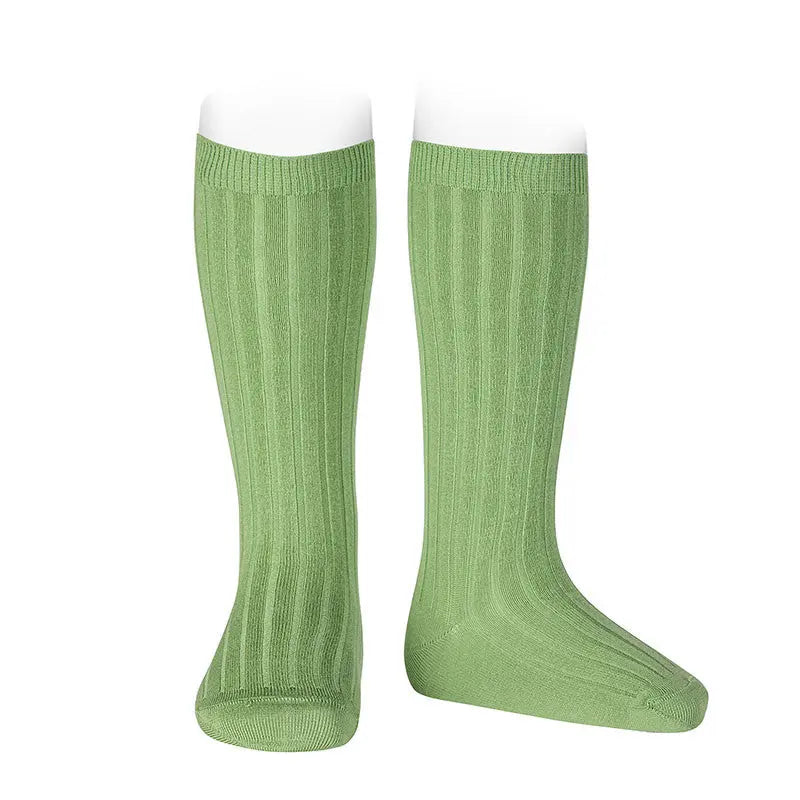 CONDOR Basic Rib Knee High Socks in pear green worn on legs, showing ribbed texture and knee-high fit.