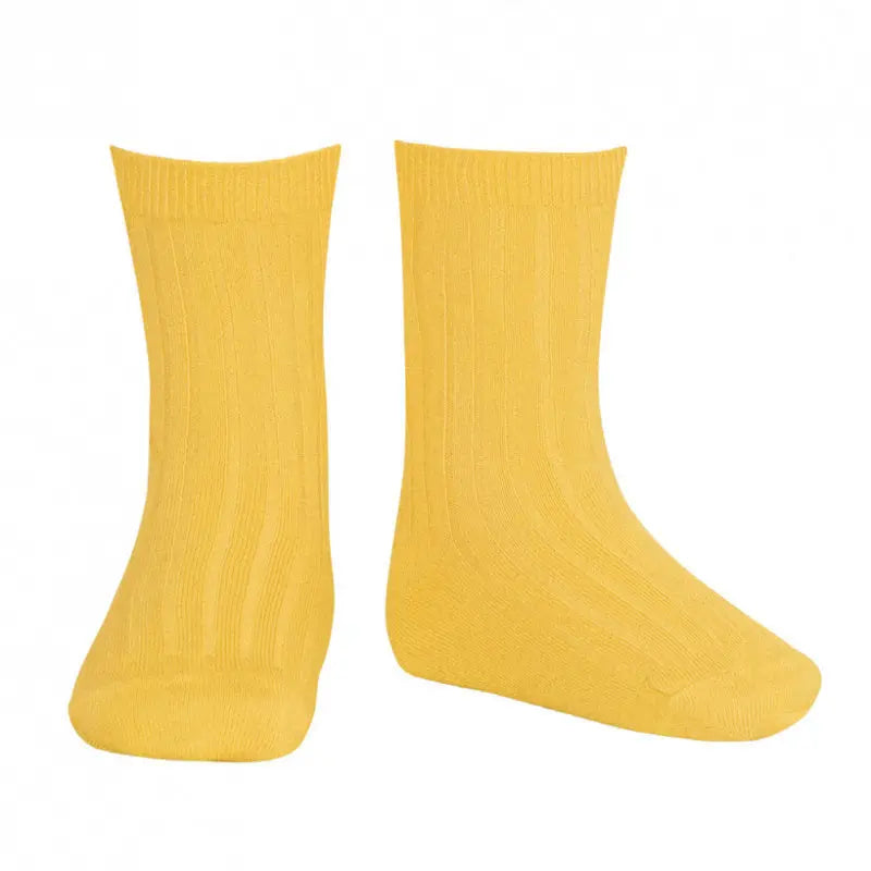 Condor Basic Rib Short Socks Yellow, a pair of bright ribbed baby socks standing upright to show cuffs and knit.