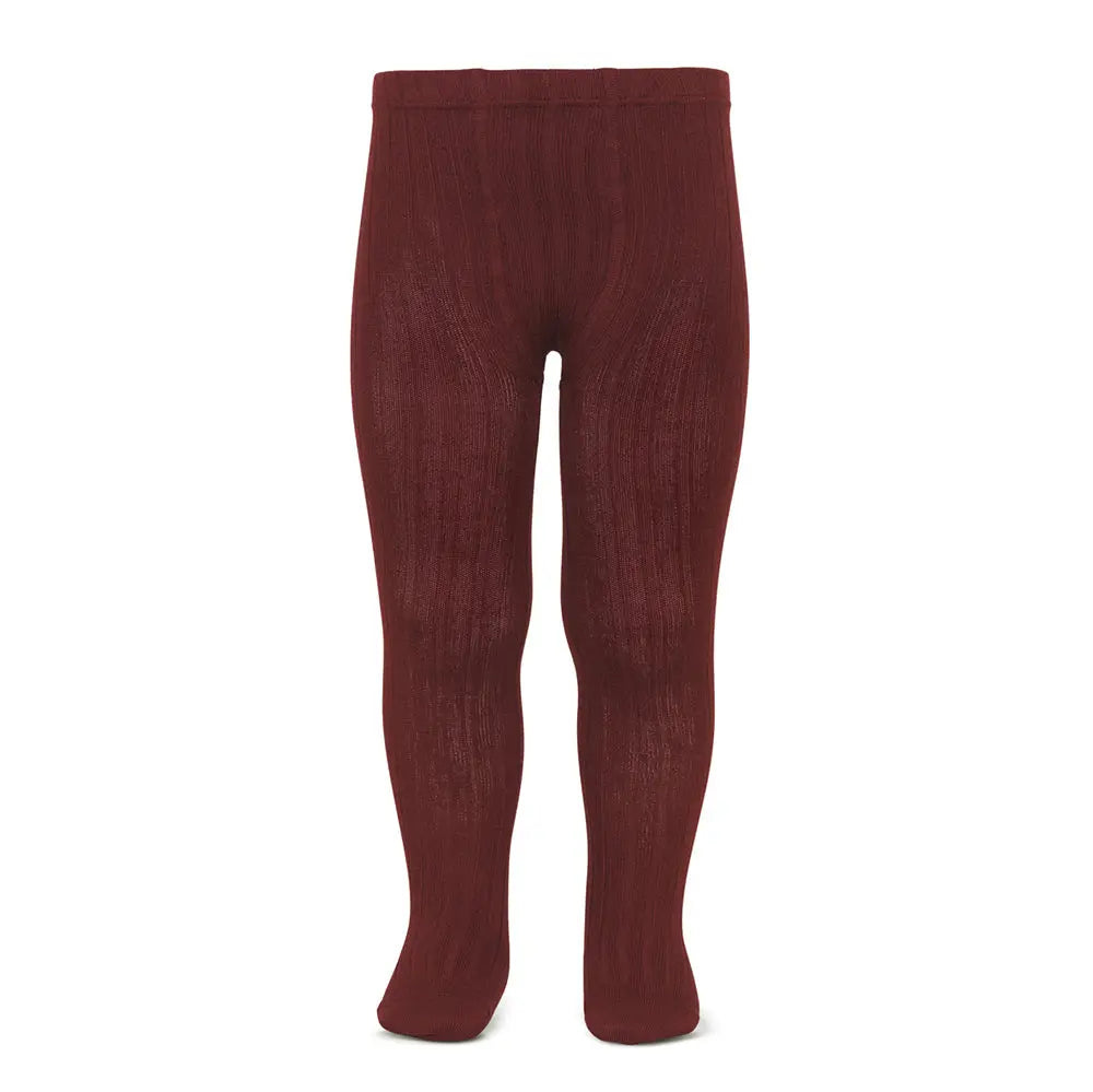 Condor Rib Basic Tights Granate for girls, burgundy knit fabric, worn by a child standing to keep her warm.