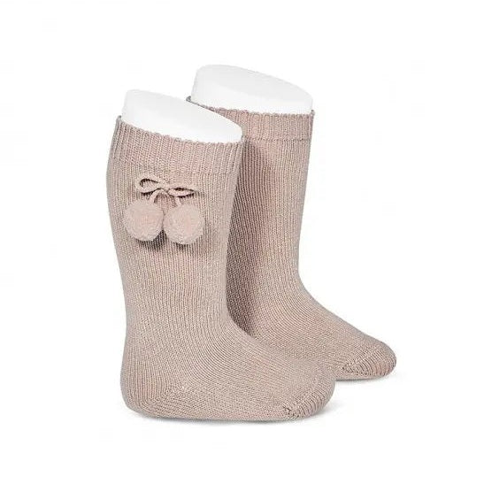Condor Warm Cotton Knee High Socks With Pompoms Stone, beige baby knee socks on display with pom-poms.