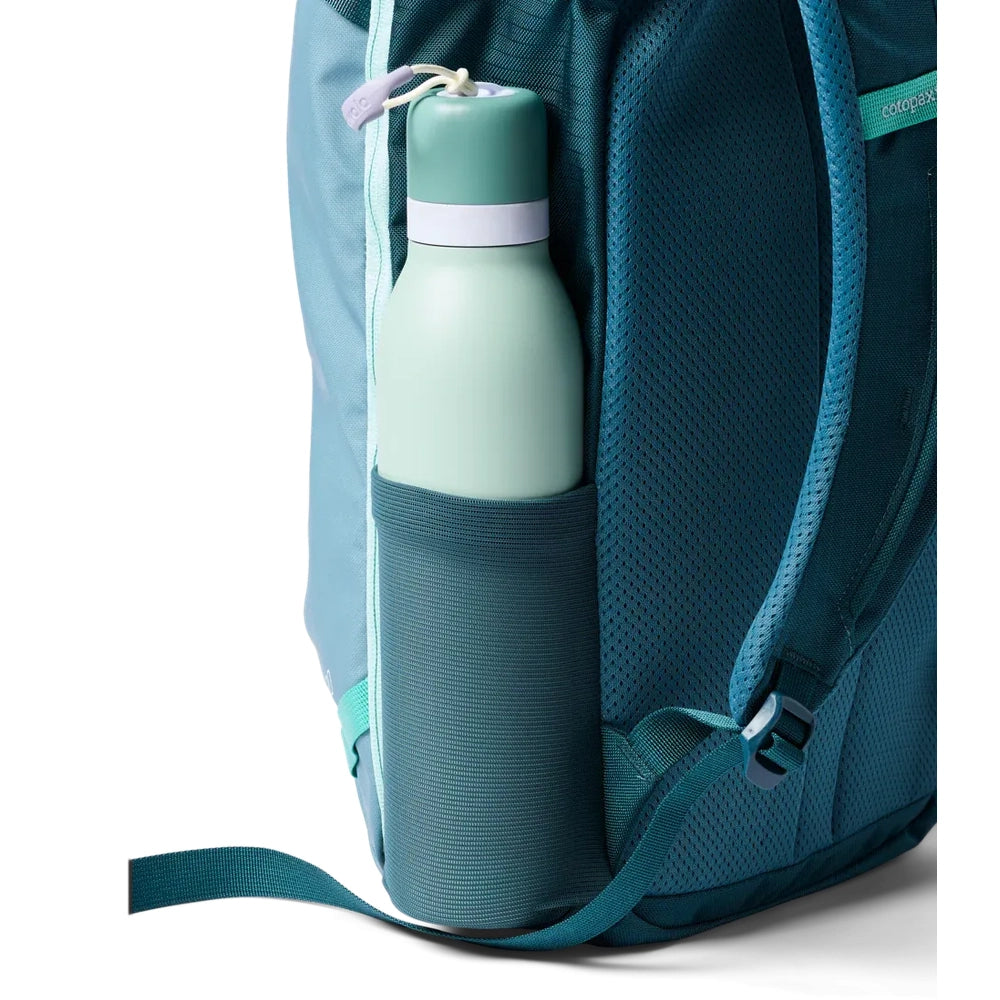 Cotopaxi Allpa Mini 20L Travel Pack Backpack in Teal with water bottle in side pocket