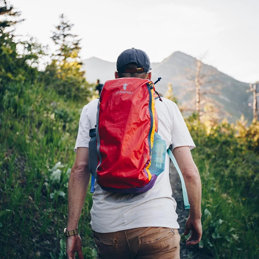 Cotopaxi Batac 16L Del Dia, daypack worn outdoors; example colourway