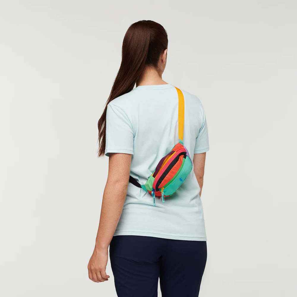 Cotopaxi Kapai 1.5L Hip Pack in Multicolor panels with yellow strap