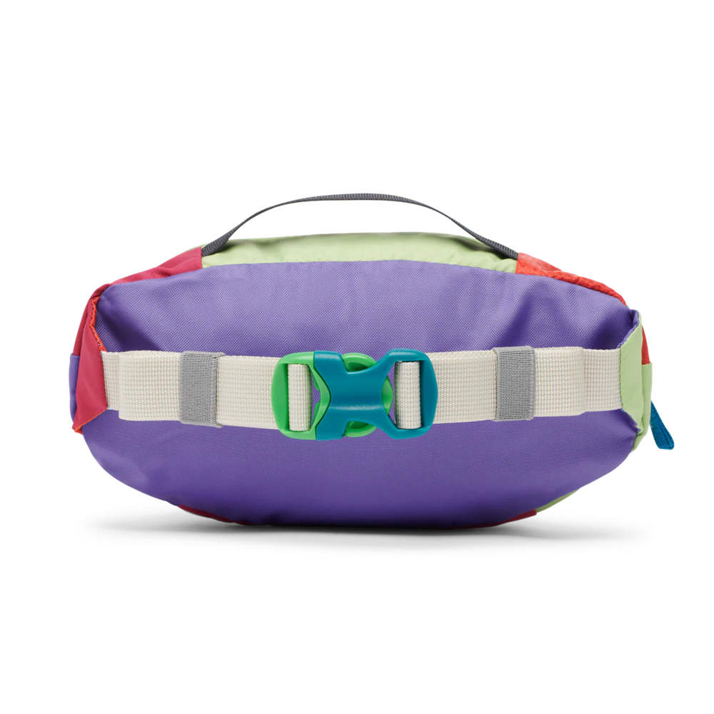 Cotopaxi Kapai 1.5L Hip Pack in Purple with multicolor panels and beige strap, green buckle.