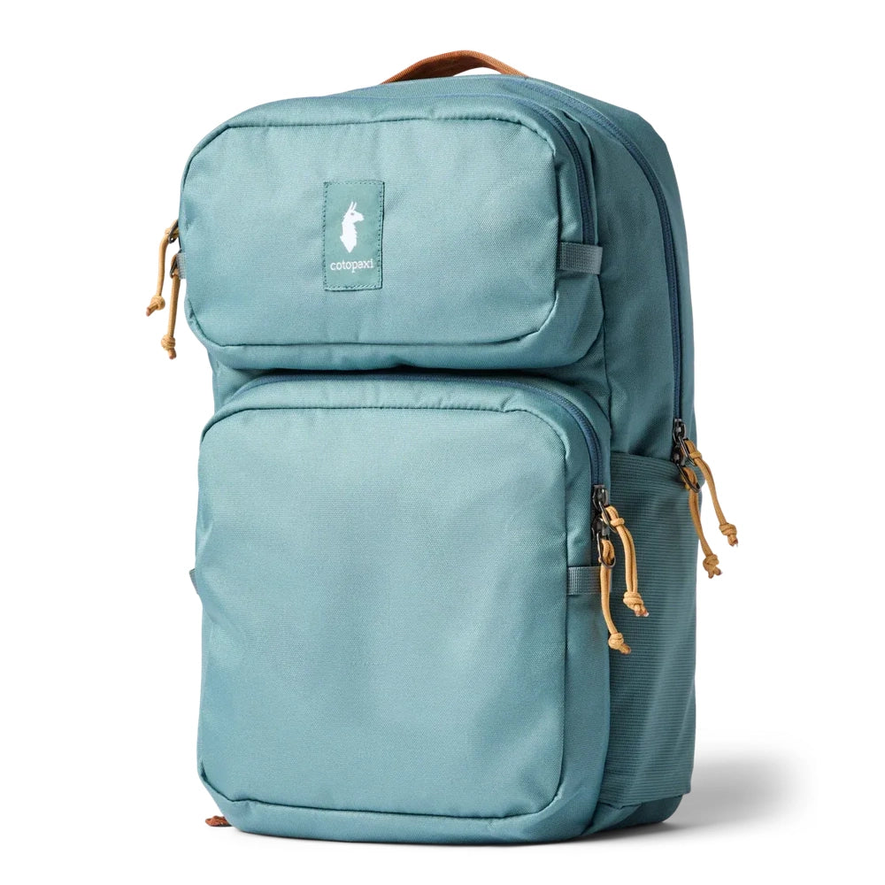Cotopaxi Tasra 16L Daypack in Teal with front zip pockets, side mesh pocket, tan paracord zipper pulls