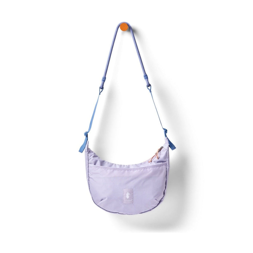 Cotopaxi Trozo 8L Shoulder Bag Cada Dia in Lavender with blue strap accents