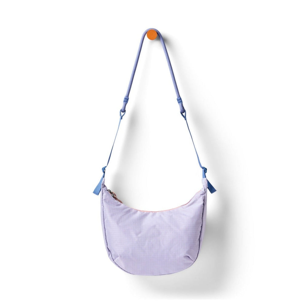 Cotopaxi Trozo 8L Shoulder Bag Cada Dia in Lavender with blue adjustable strap