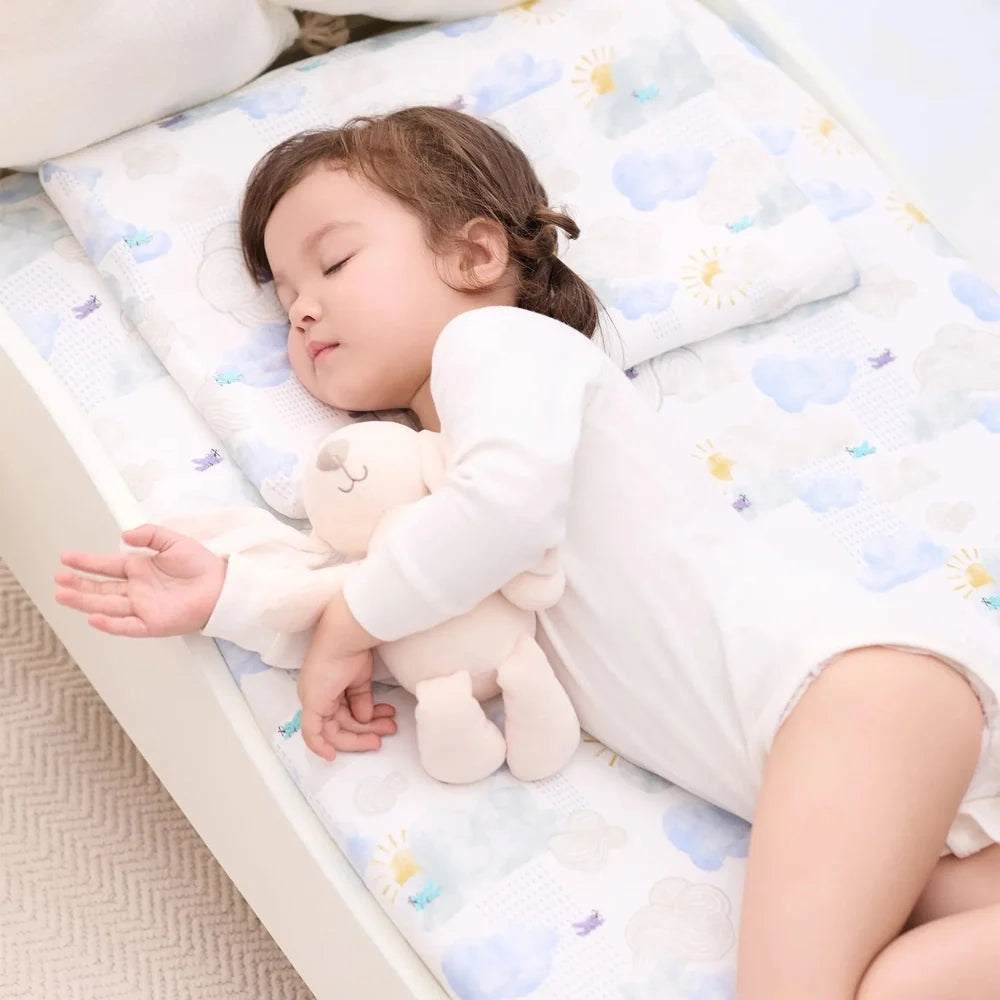 NEST DESIGNS Nest Designs Bamboo Crib Sheet Small Fluffy Puffs fitted with elastic edges and cloud sun pattern img 2/6