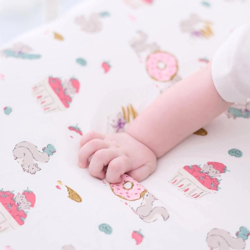 NEST DESIGNS Nest Designs Bamboo Crib Sheet Small Very Squirrelly printed with donuts, cupcakes, and whimsical animals img 4/5