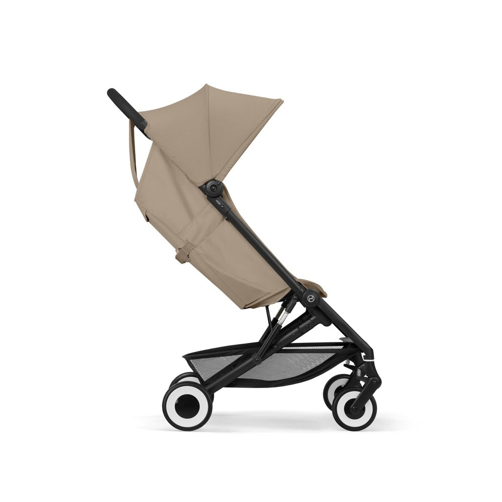 Close-up of the Cybex Agis Lightweight Travel Stroller beige cybex agis travel stroller with black frame, beige canopy and seat, white-rimmed wheels.
