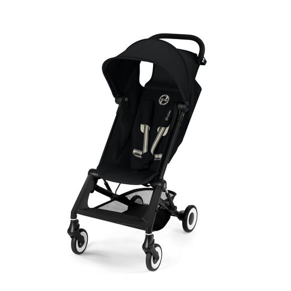 Close-up of the Cybex Agis Lightweight Travel Stroller black cybex agis travel stroller with aluminum frame, black canopy, silver harness buckles, four wheels with white rims.