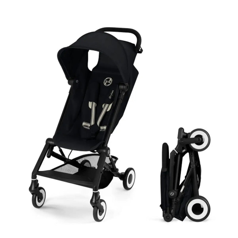 Close-up of the Cybex Agis Lightweight Travel Stroller black cybex agis ultra-compact travel stroller with canopy, padded seat, four white-rimmed wheels; foldable.