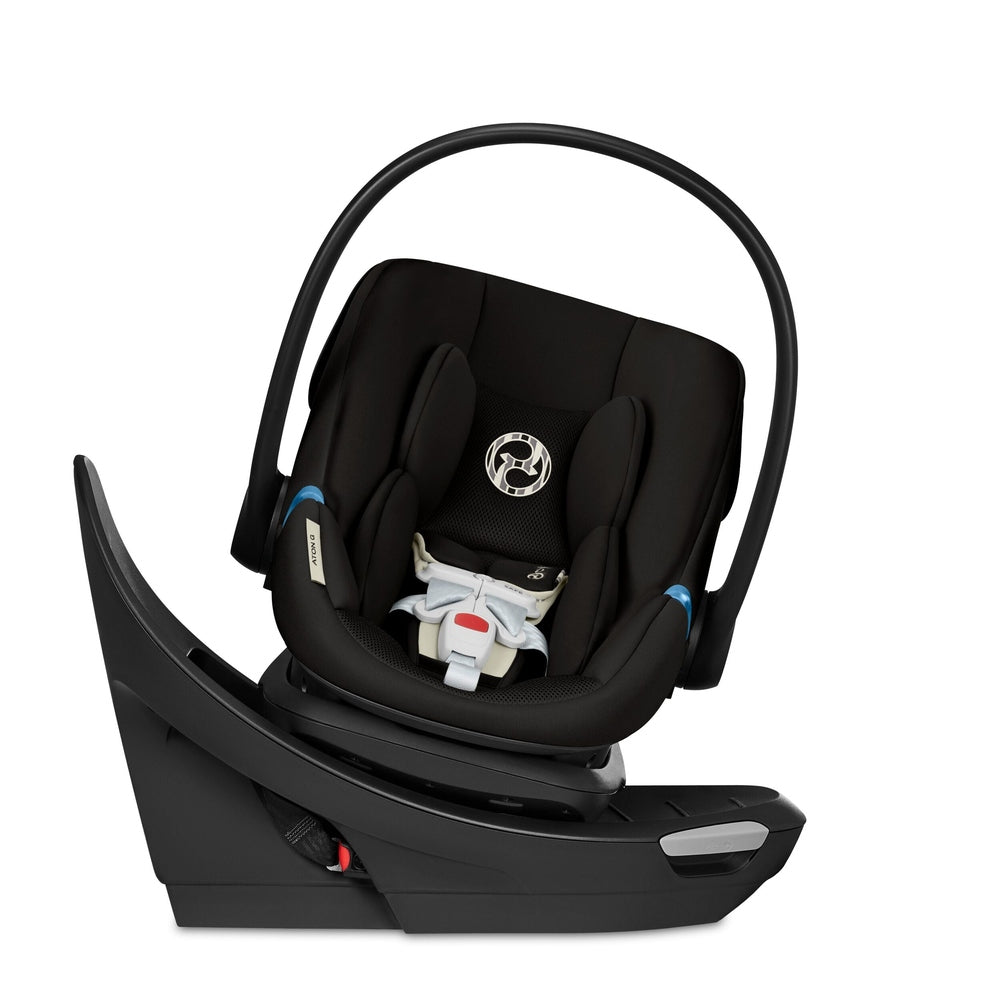Close-up of the Cybex Aton G Swivel Sensorsafe Infant Car Seat black fabric infant car seat with curved handle, swivel base, and 5-point harness with blue accents.