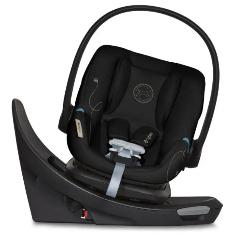 Close-up of the Cybex Aton G Swivel Sensorsafe Infant Car Seat in black, securely mounted on base with swiveling handle.
