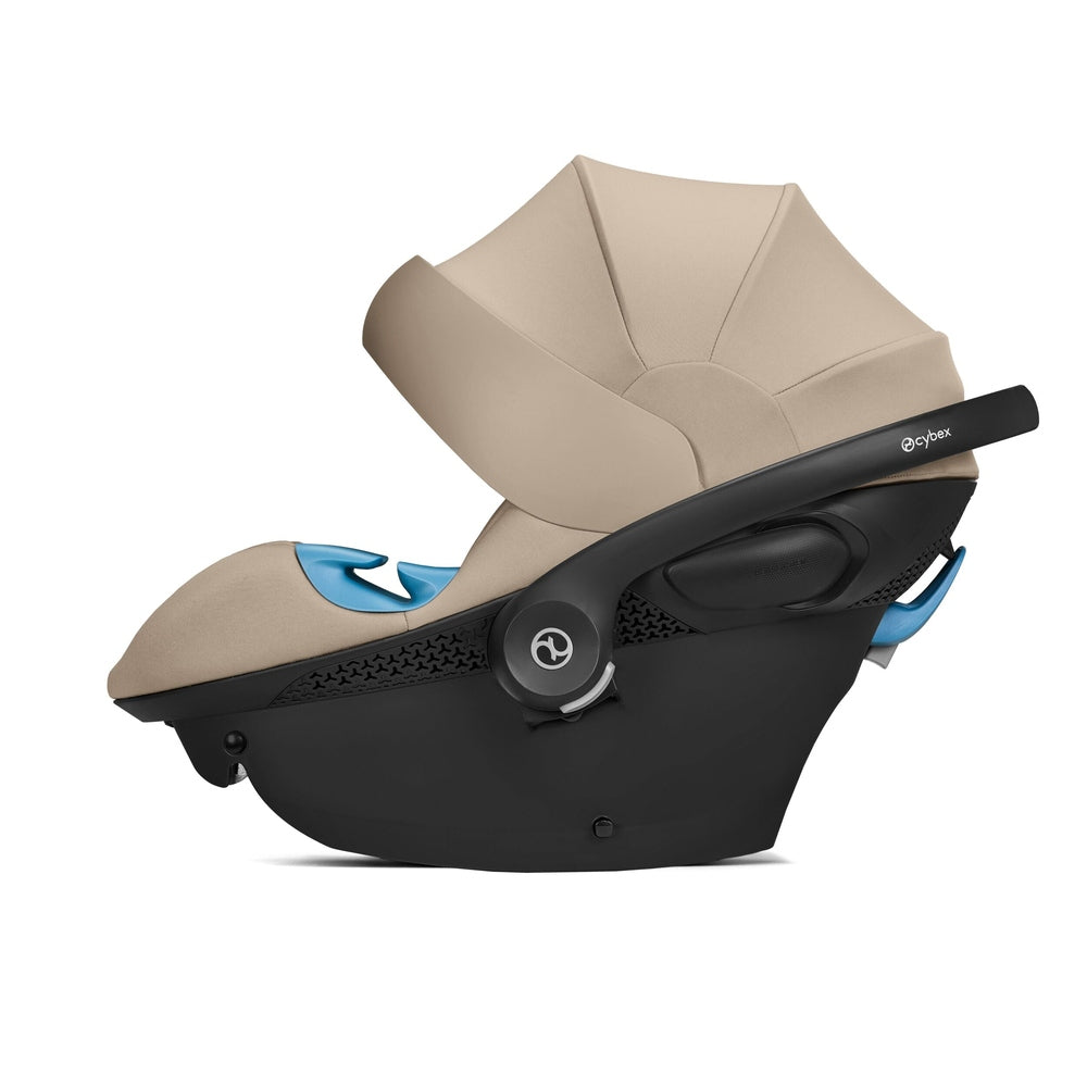 Close-up of the Cybex Aton G Swivel Sensorsafe Infant Car Seat in beige fabric with black base, blue accents, and extended beige canopy.
