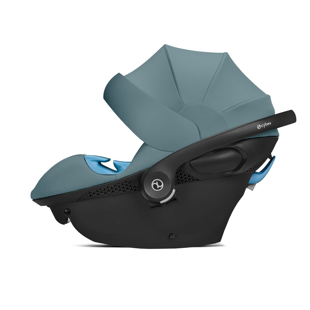 Close-up of the Cybex Aton G Swivel Sensorsafe Infant Car Seat teal fabric cybex aton g infant car seat with black shell and blue accents.