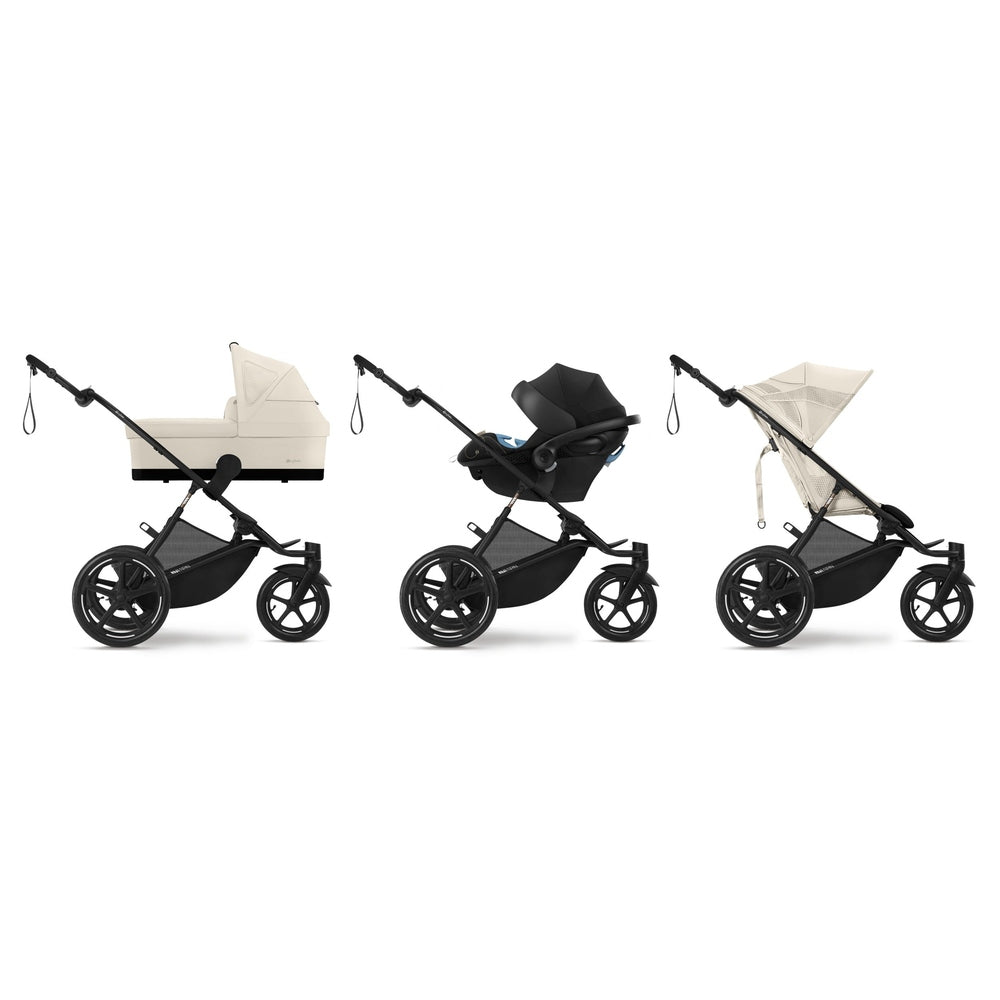 Close-up of the Cybex Avi Spin All Terrain Stroller full set: bassinet, infant car seat, and seat in cream/black with rugged wheels.