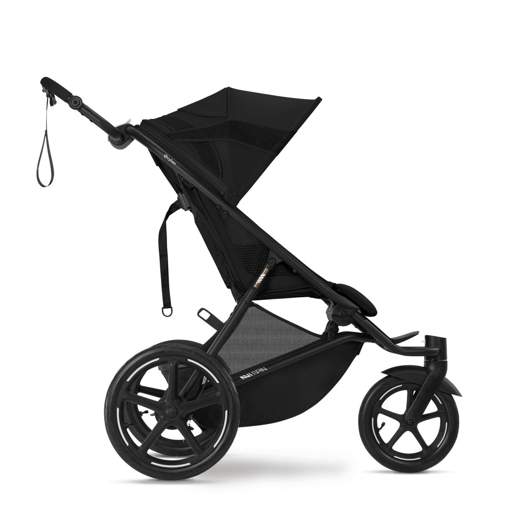 Close-up of the Cybex Avi Spin All Terrain Stroller in black, pushed by a parent with large wheels ready for off-road jogging.
