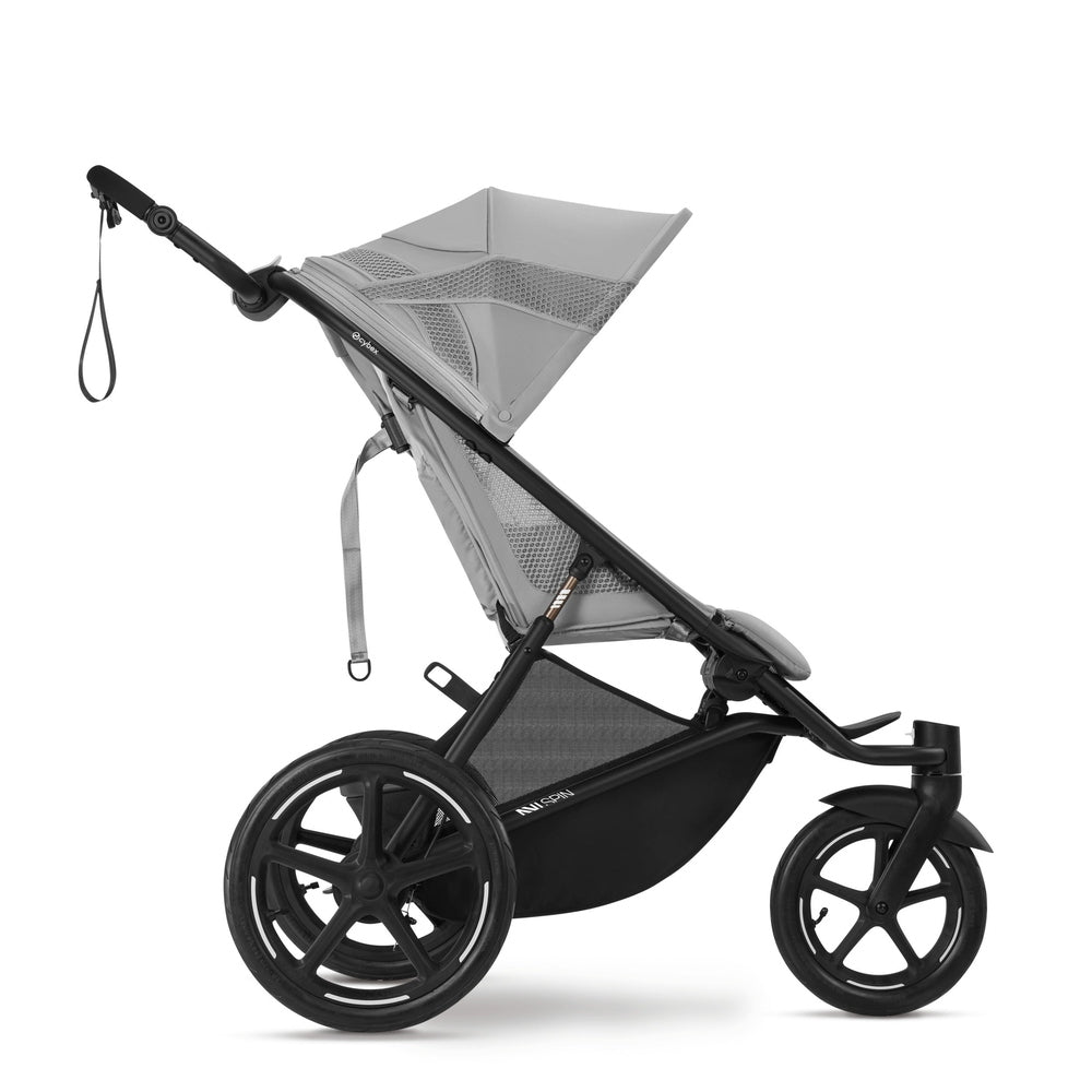 Close-up of the Cybex Avi Spin All Terrain Stroller in gray with large rear wheels ready to roll.