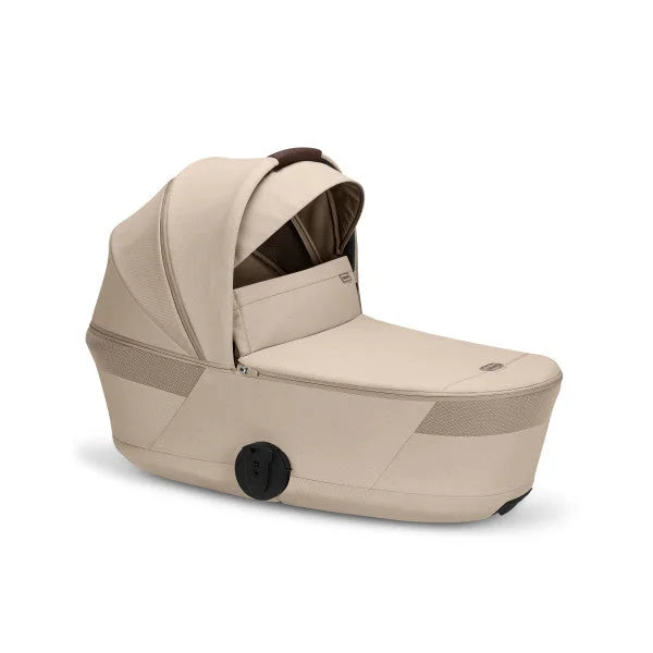 CYBEX Balios Fold Cot in Almond Beige, front three-quarter view