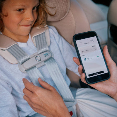 Cybex Callisto G 360 Rotating All-In-One Convertible Car Seat in Stone Grey with SensorSafe chest clip and mobile app shown in use