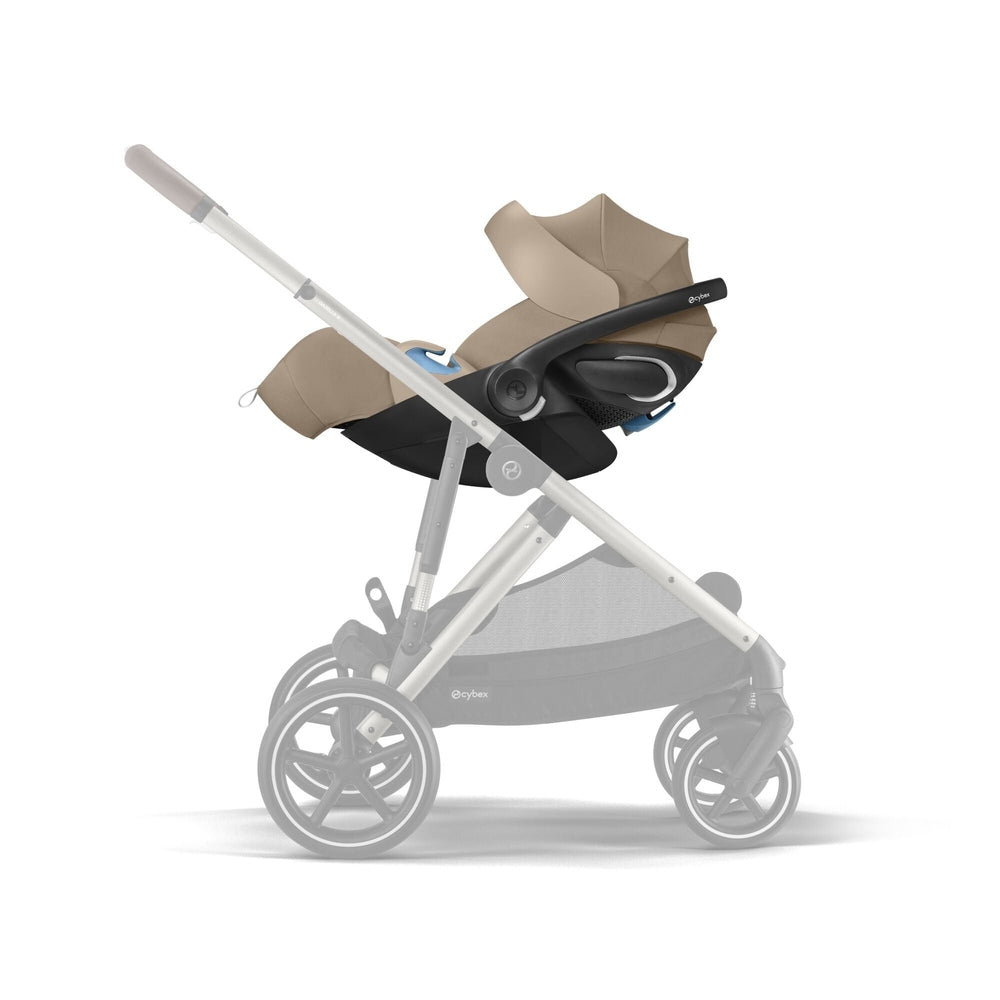Cybex Cloud G Pro Infant Car Seat with SensorSafe and Load Leg Base in Almond Beige attached to a stroller frame as a travel system