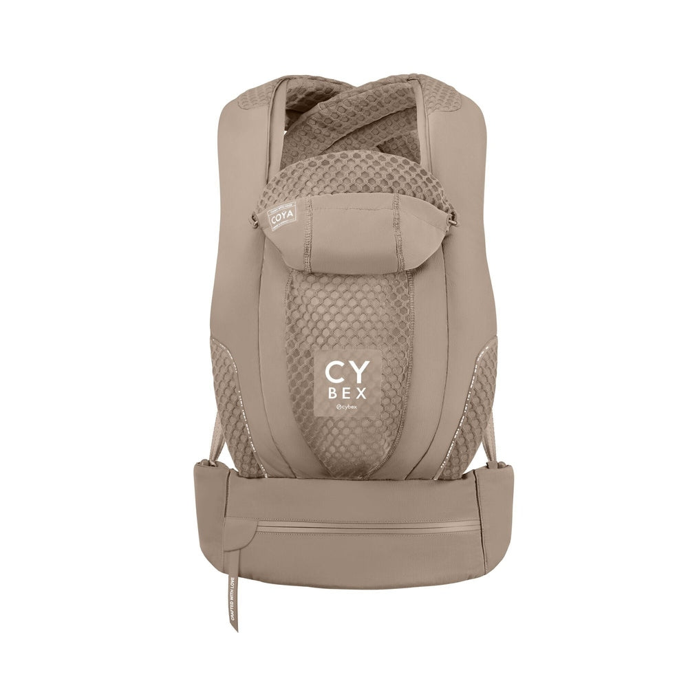 Close-up of the Cybex Coya Carrier beige cybex coya baby carrier with padded straps, mesh back panel, waist belt, and visible coya tag.