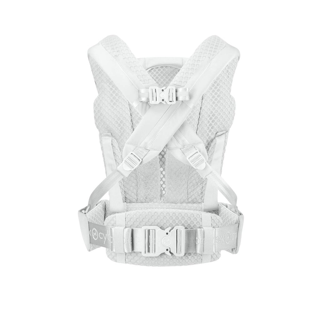 Close-up of the Cybex Coya Carrier in light gray/white with padded mesh straps and secure buckles.