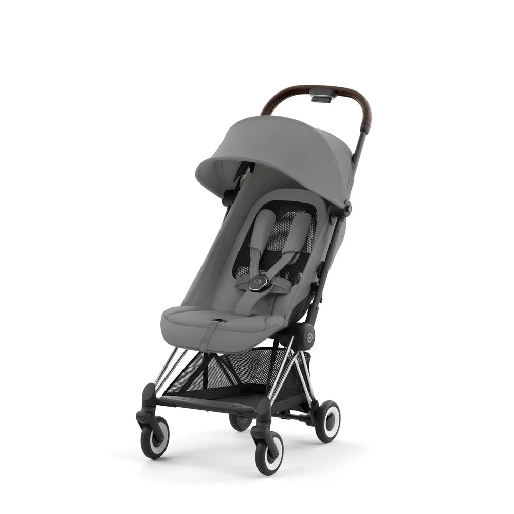 Close-up of the Cybex Coya Chrome Frame Stroller in grey fabric with canopy and 4-wheel frame, ready to stroll.