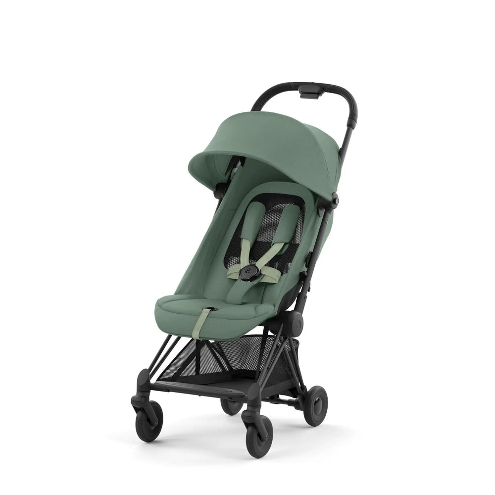 Close-up of the Cybex Coya Matt Black Frame Stroller in moss green fabric with sun canopy and 5-point harness.