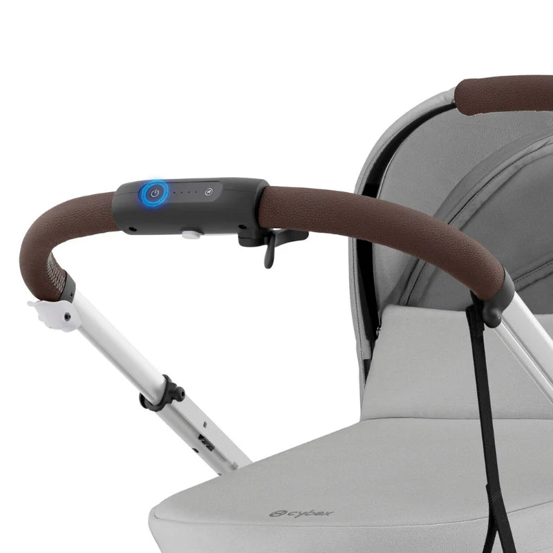 Close-up of the Cybex E-Gazelle S Stroller handlebar with brown leatherette grip and blue-lit control module.