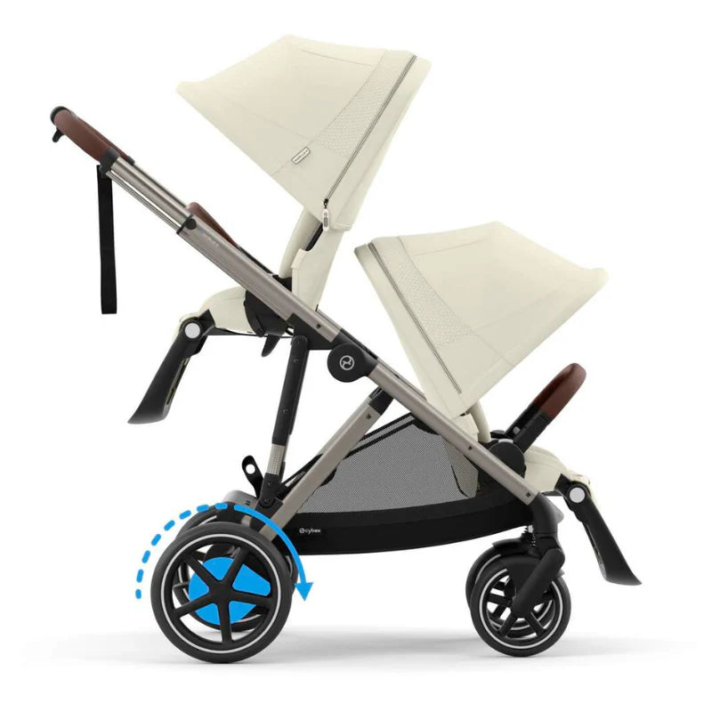 Close-up of the Cybex E-Gazelle S Stroller with dual beige seats and large wheels; front wheel swivels for easy maneuverability.