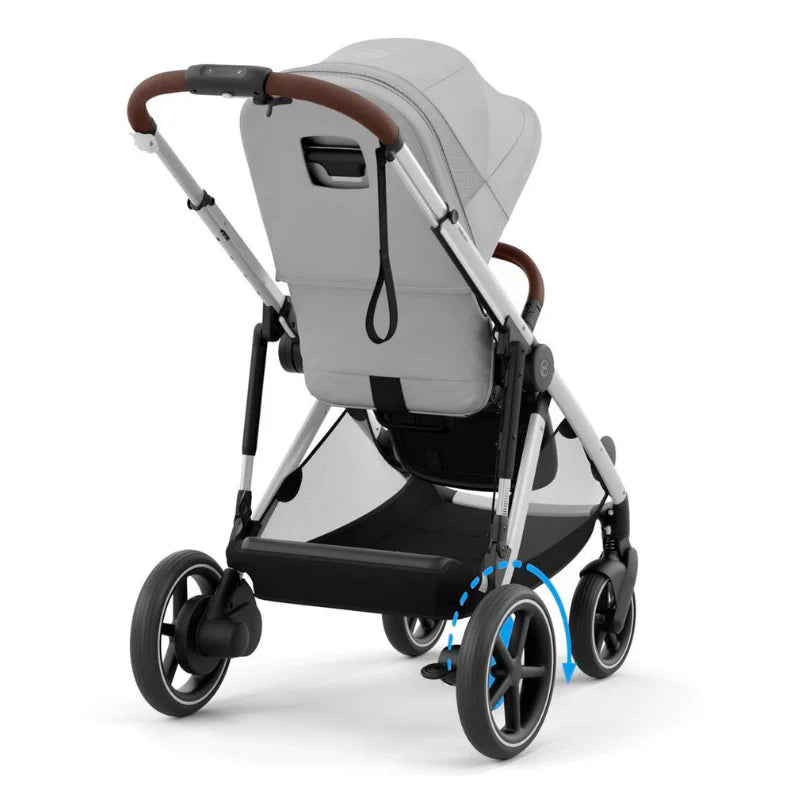 Close-up of the Cybex E-Gazelle S Stroller in grey fabric with brown leather handle, front wheels swiveling for easy steering.