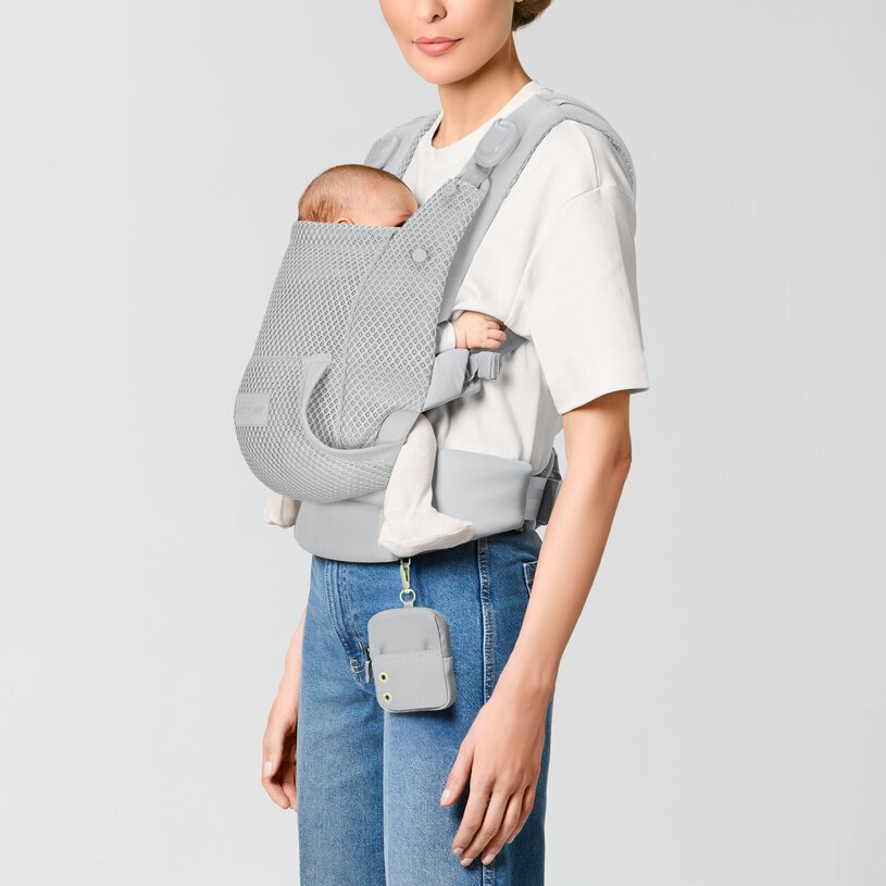 CYBEX Gold Laya Baby Carrier in Fog Grey with newborn in front inward carry
