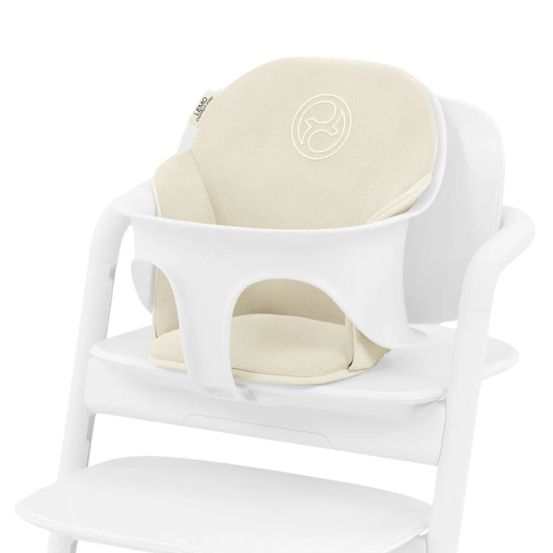 Close-up of the Cybex Lemo 2 Comfort Inlay beige fabric comfort inlay for cybex lemo 2 high chair on white plastic frame.