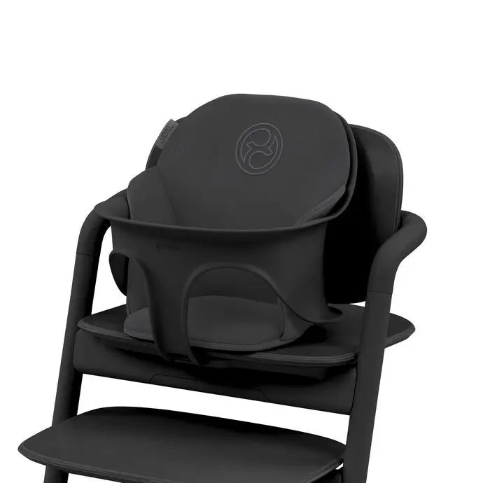 Studio product image of the Cybex Lemo 2 Comfort Inlay in black secured to a high chair, providing padded infant head and body support.